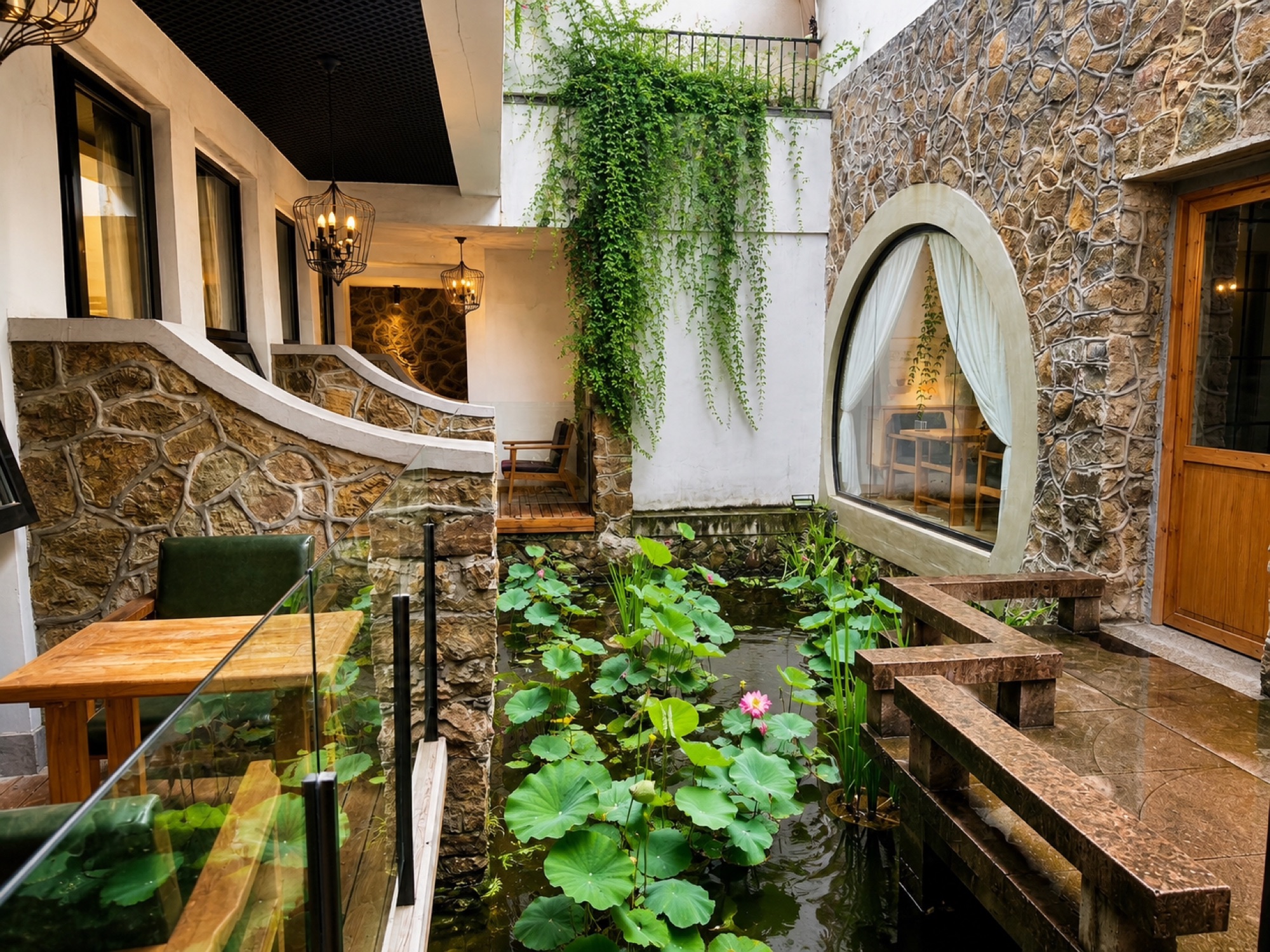 Lotus pond and stone courtyard inside the homestay